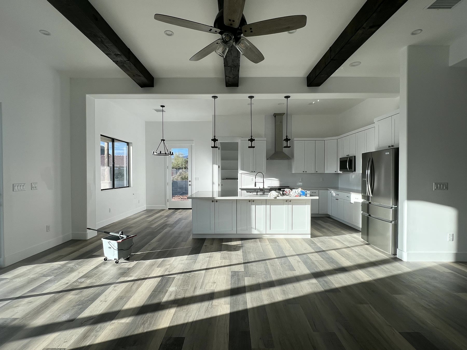Before staging image of an empty Gold Canyon living and kitchen space
