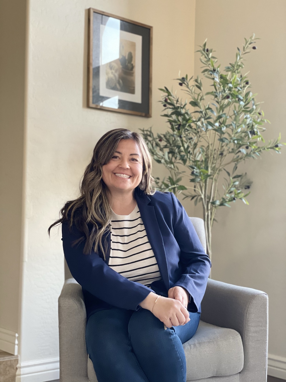 Staged Local team member seated in a styled home interior