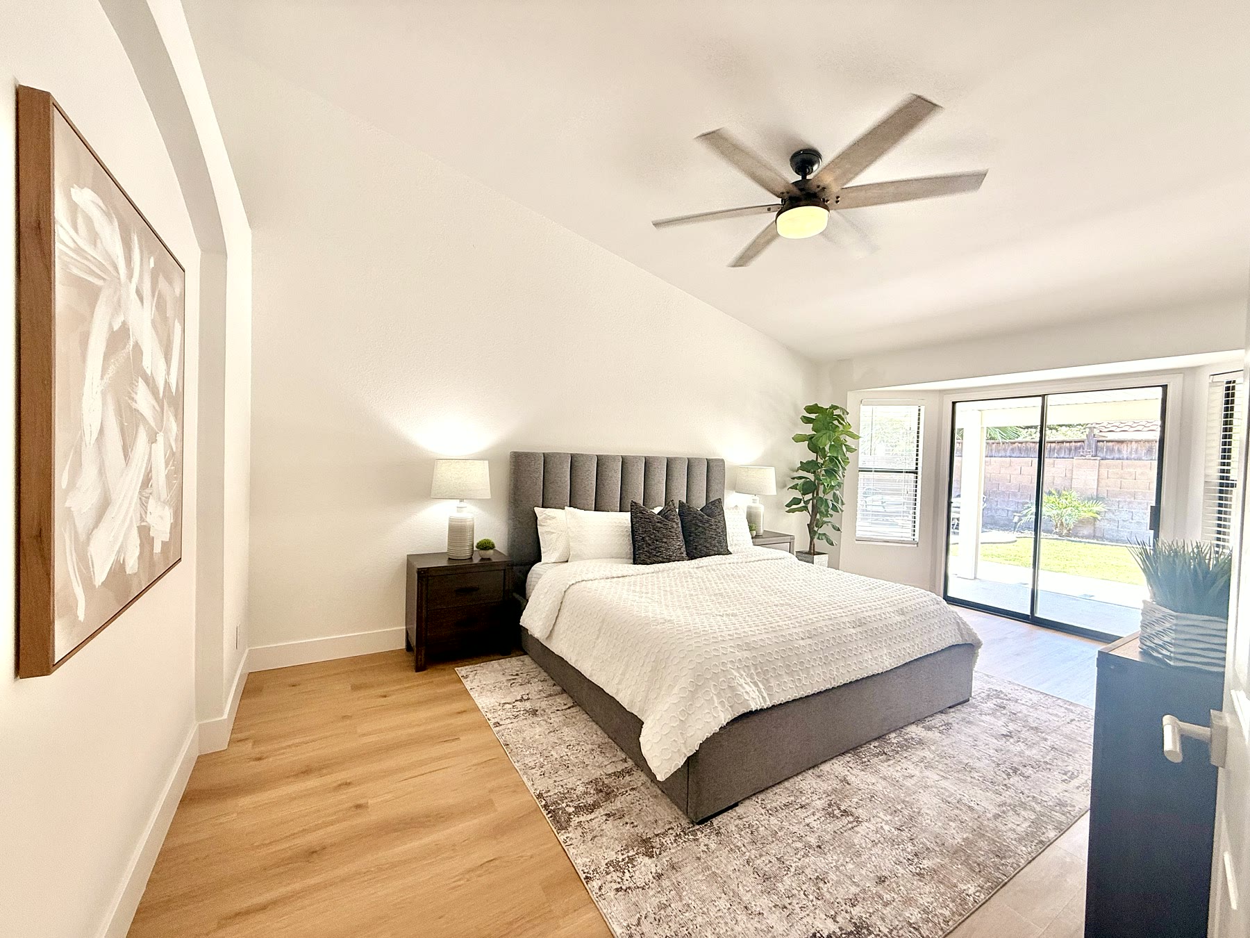 Gilbert bedroom staged with clean bedding and bedside accents