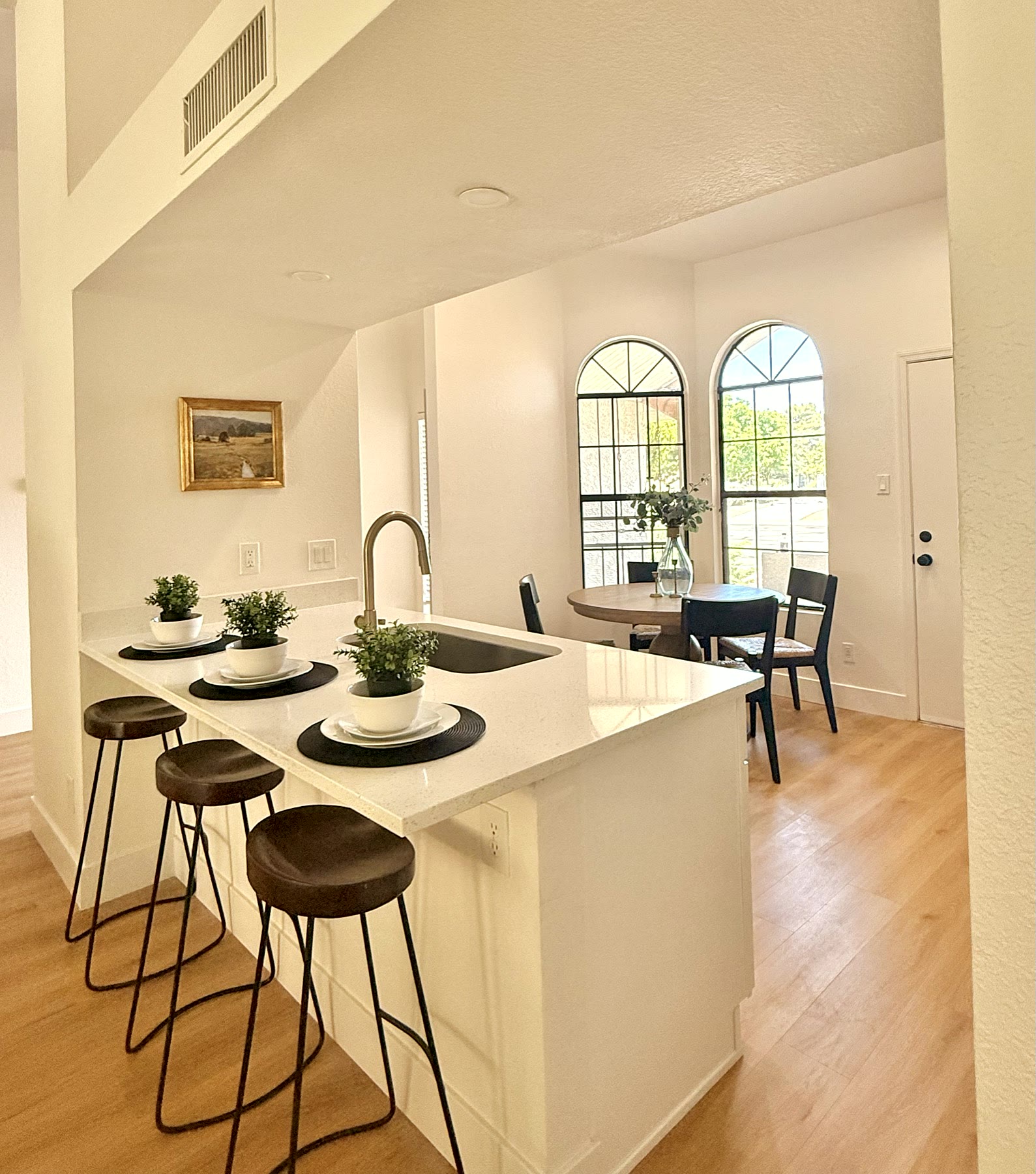 Gilbert kitchen island staged with clean counters and seating