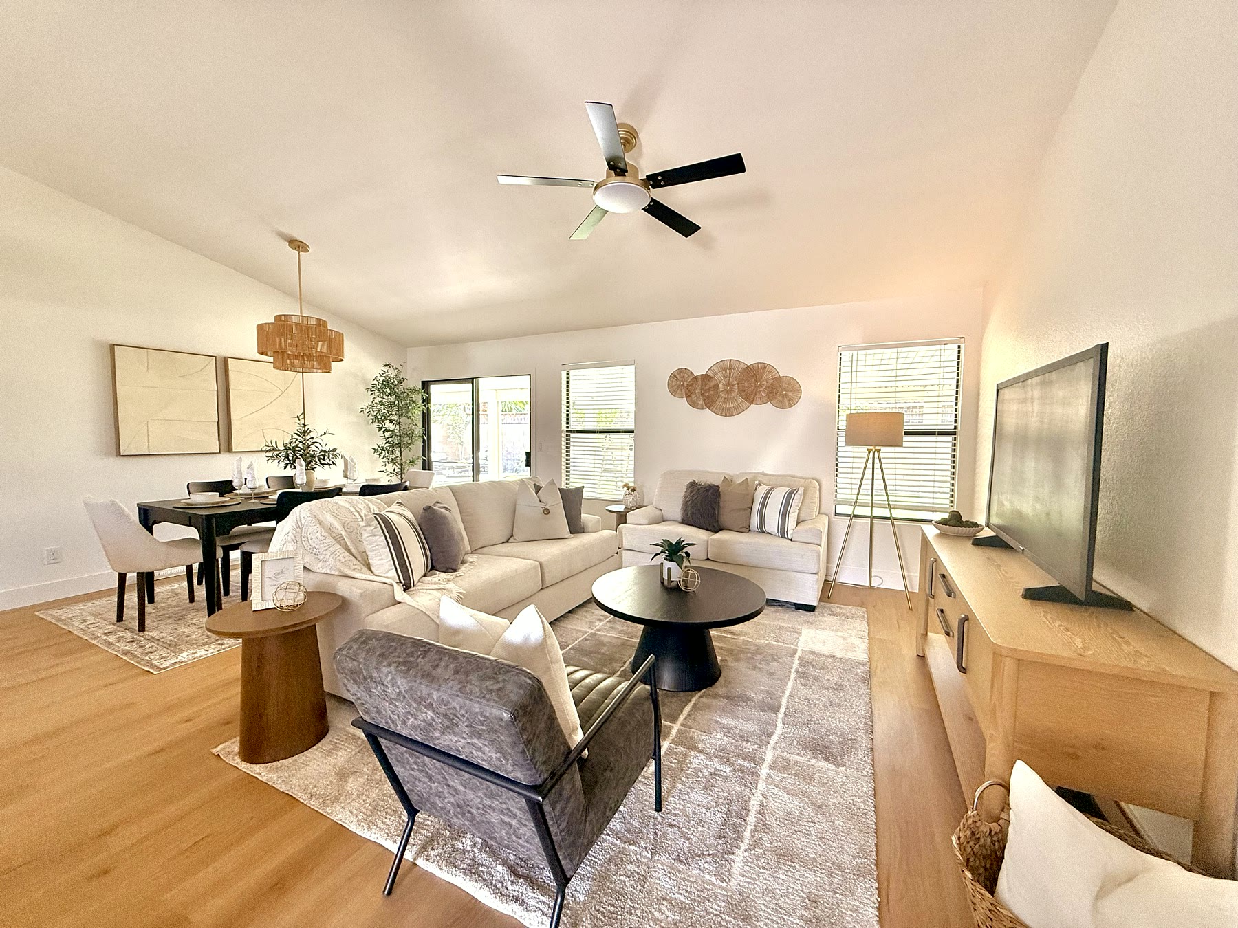 Occupied home living area refined with modern staging details