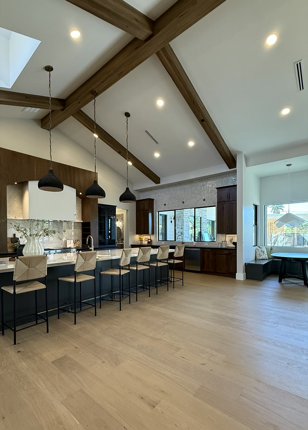 Luxury Scottsdale great room staged with vaulted ceilings and refined furnishings