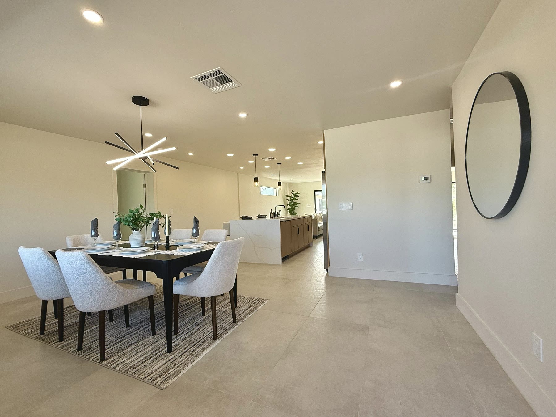Phoenix staged living and dining area with bright finishes