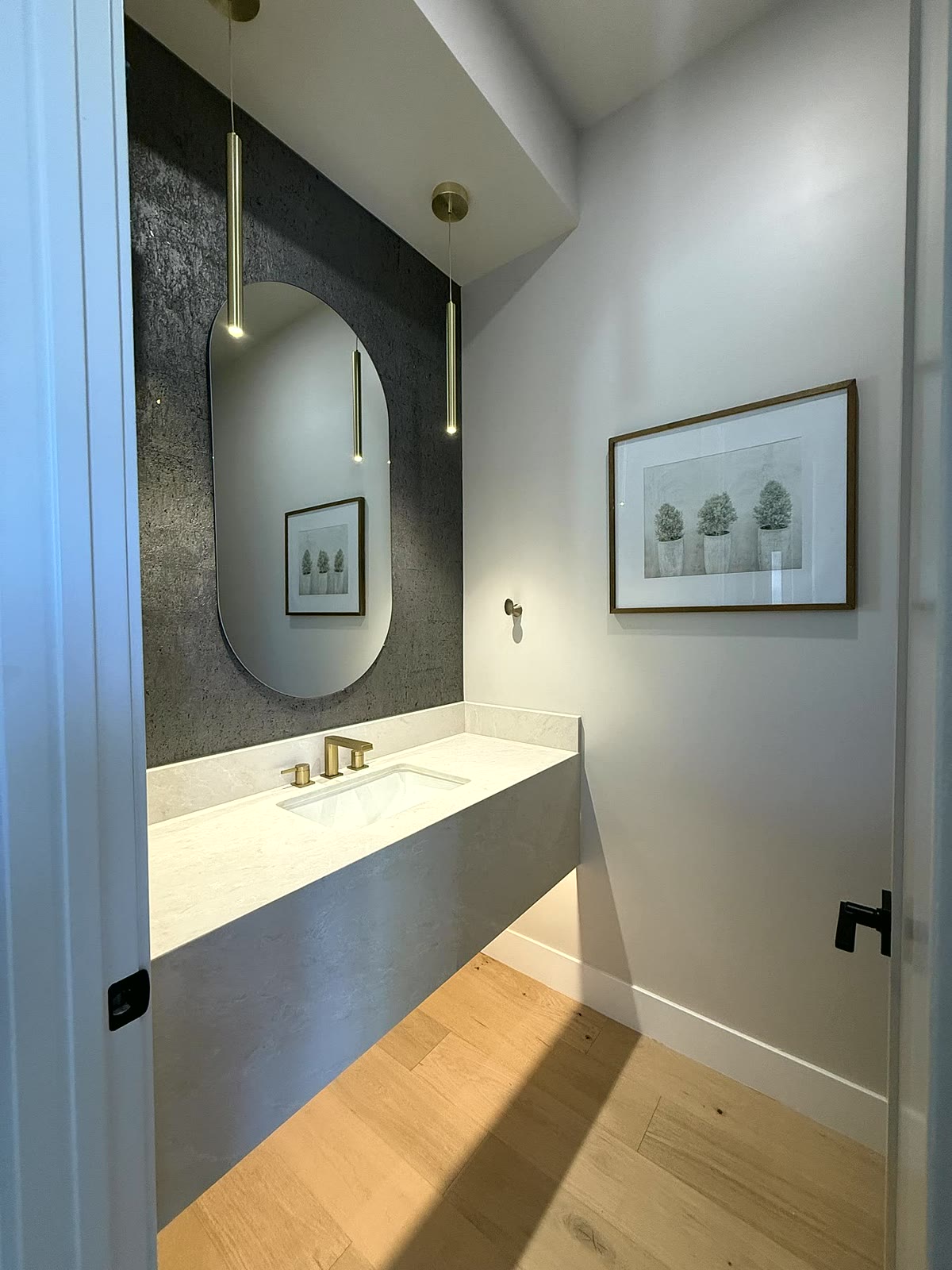 Phoenix bathroom styled with a vanity, mirror, wall art, and soft staging details
