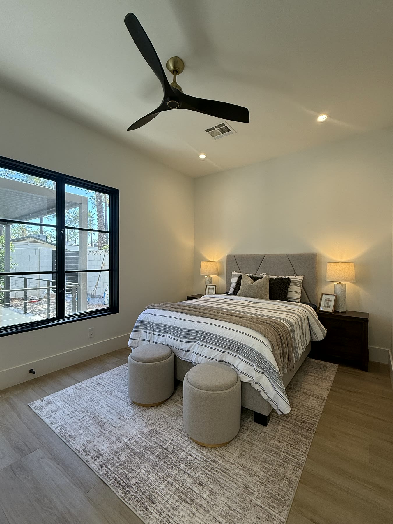 Scottsdale bedroom staged with refined neutral bedding